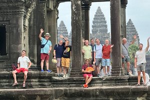 Group of people standing in front of a temple in Angkor